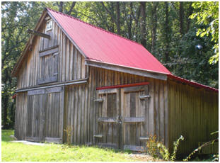 This new pole-barn was built to look as if it was a hundred-year-old, traditional Maryland barn. It was built from inexpensive stock pole-barn plans by architect Don Berg
